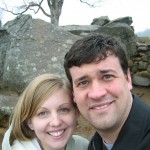 us-at-devils-den Us at Devil's Den. Immediately behind us is the location of the famous picture of a dead Confederate soldier. You can see the restored version of the original stone wall, Little Round Top in the distance.